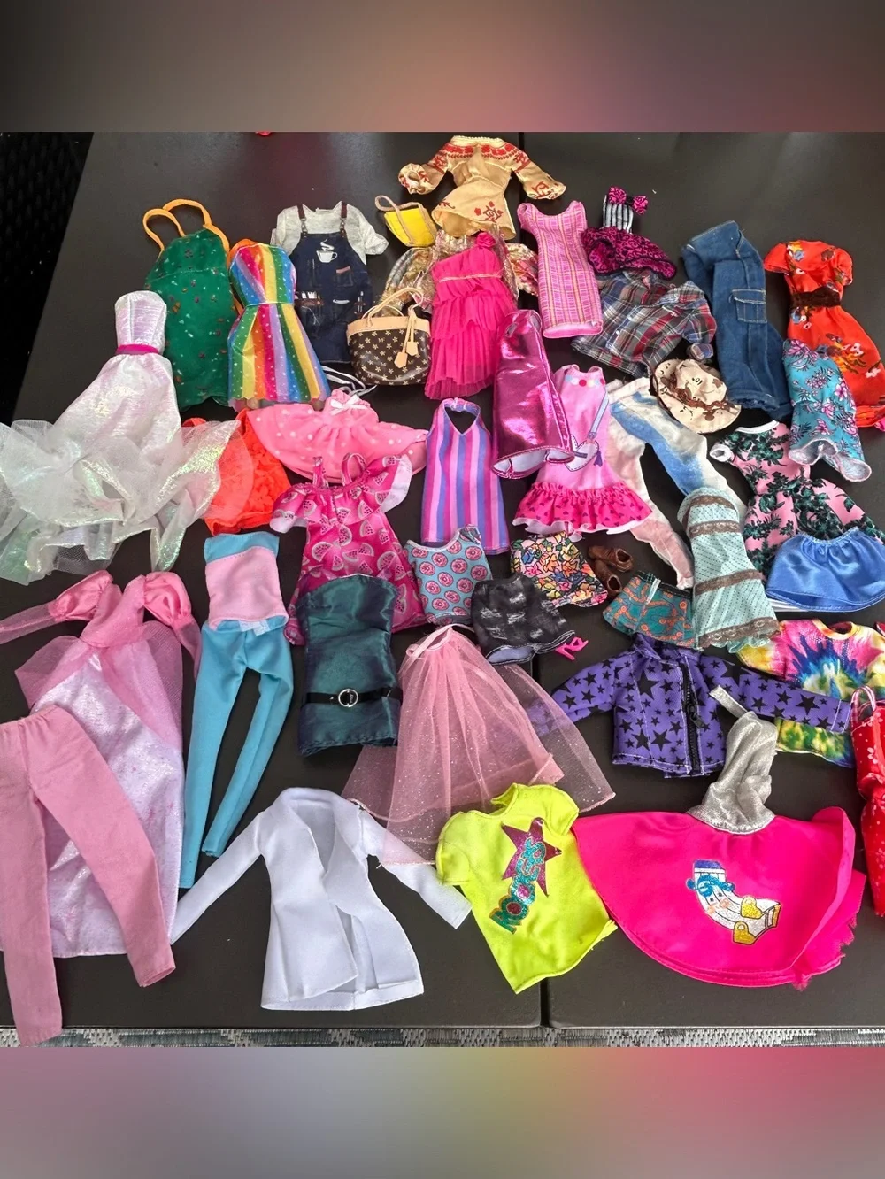 lot of Barbie and unbranded doll clothes